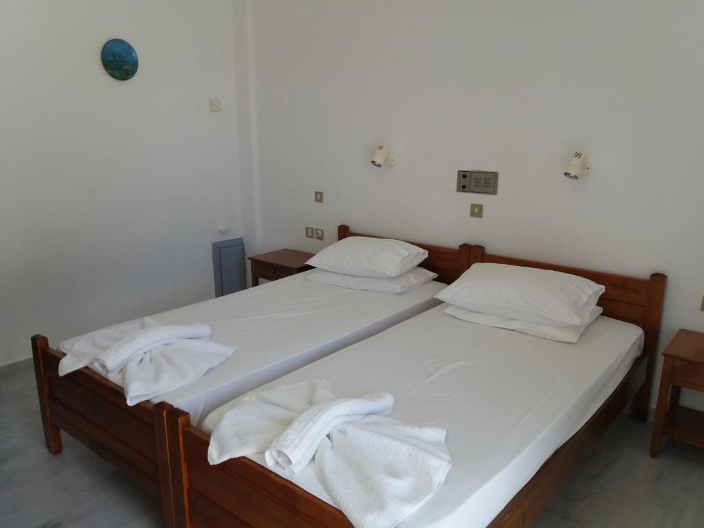 Postel nebo postele na pokoji v ubytování Heracles Hotel