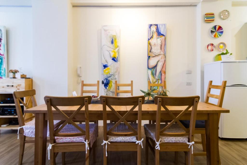 a dining room with a wooden table and chairs at Wendy's home Toucheng Mansion B in Toucheng