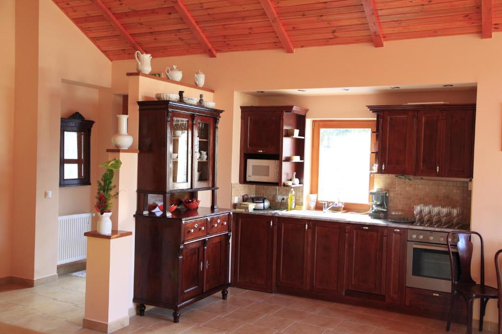Kuchyň nebo kuchyňský kout v ubytování LuDo Apartman Hotel & Spa