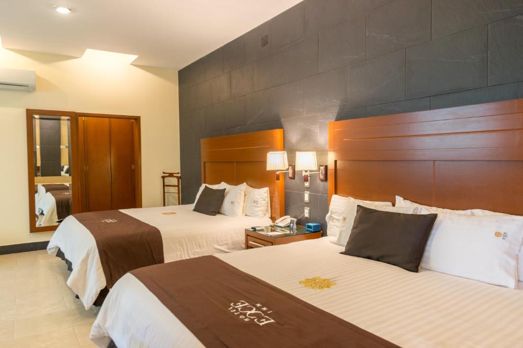 Postel nebo postele na pokoji v ubytování Hotel Ecce Inn & Spa