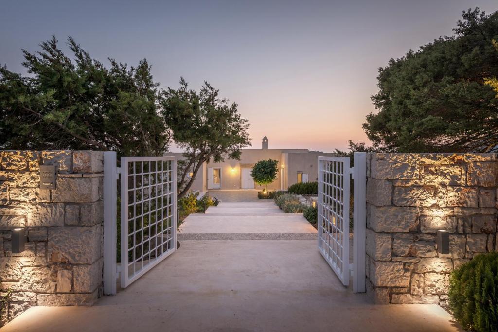 a gate leading to a villa at dusk at Villa Chez Julie in Kythira