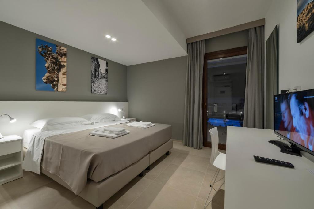 Łóżko lub łóżka w pokoju w obiekcie Southeast Hotel