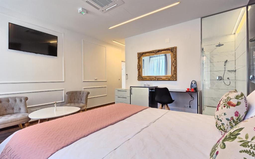 Postel nebo postele na pokoji v ubytování Mincheta - Luxury Rooms