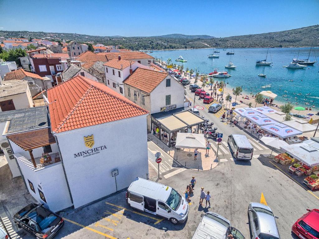 an aerial view of a town with a body of water at Mincheta - Luxury Rooms in Primošten