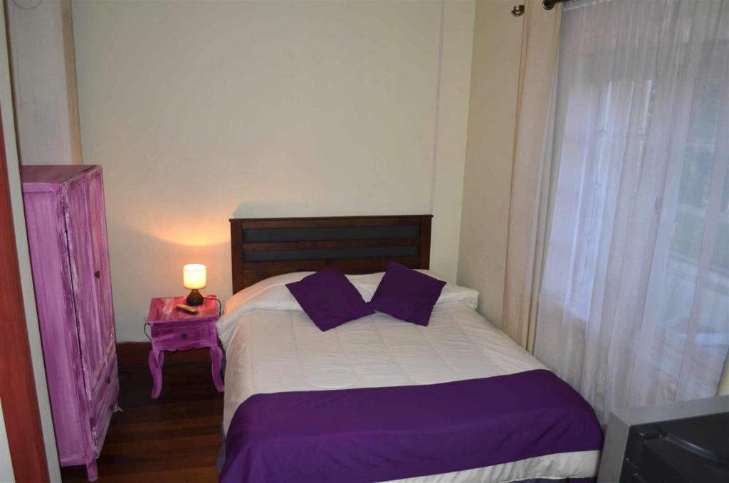 Cama o camas de una habitación en Hostal Arrayan