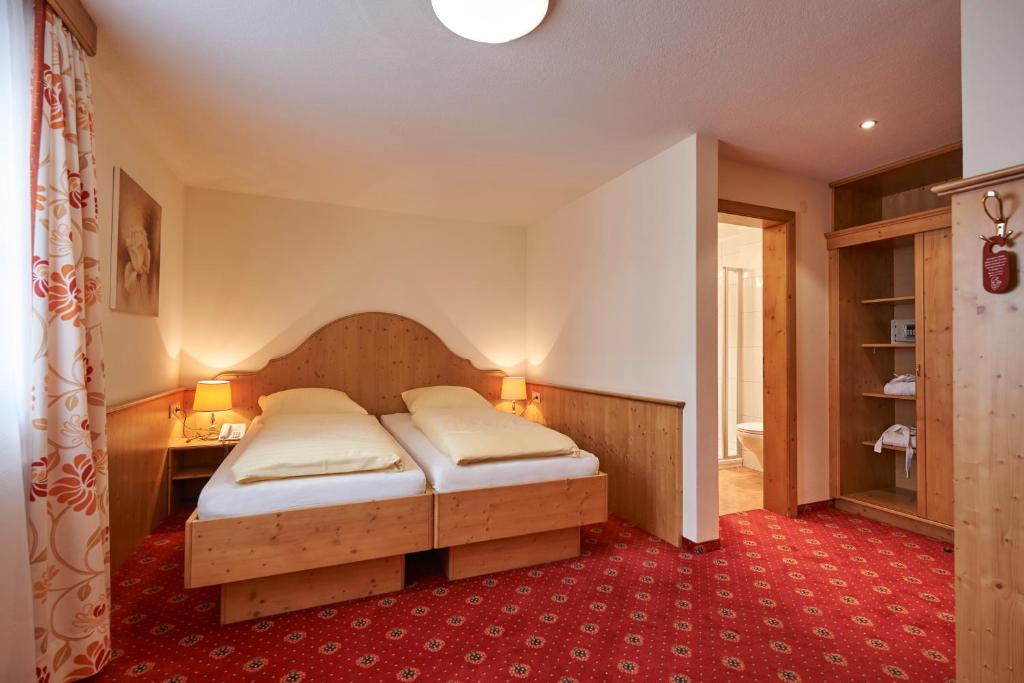 Postel nebo postele na pokoji v ubytování Après Post Hotel