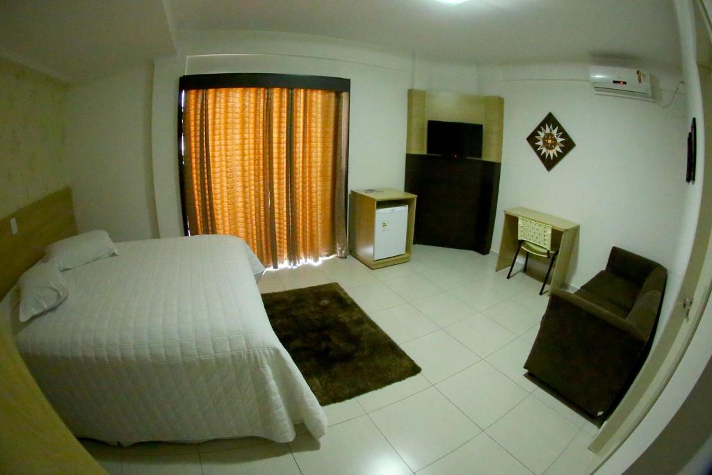 Postel nebo postele na pokoji v ubytování Morangos Hotel