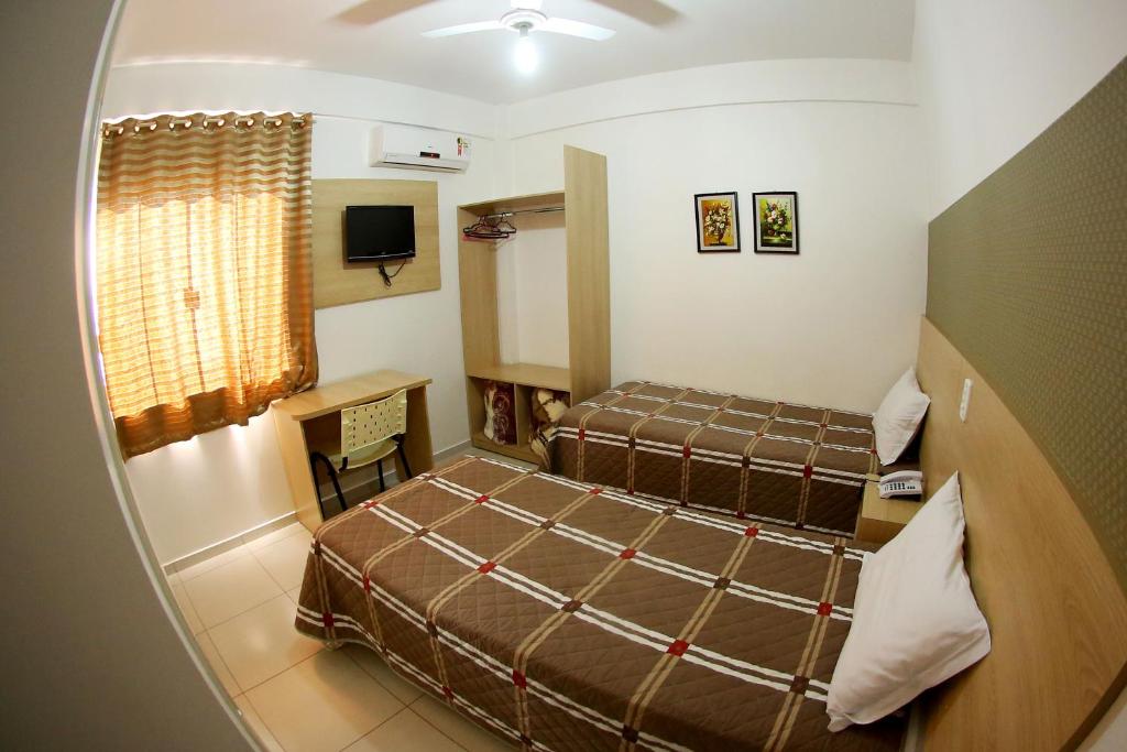 Postel nebo postele na pokoji v ubytování Morangos Hotel