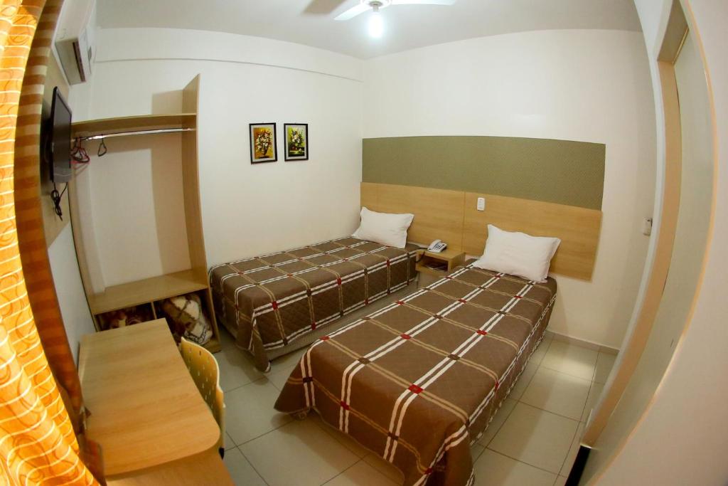 Postel nebo postele na pokoji v ubytování Morangos Hotel