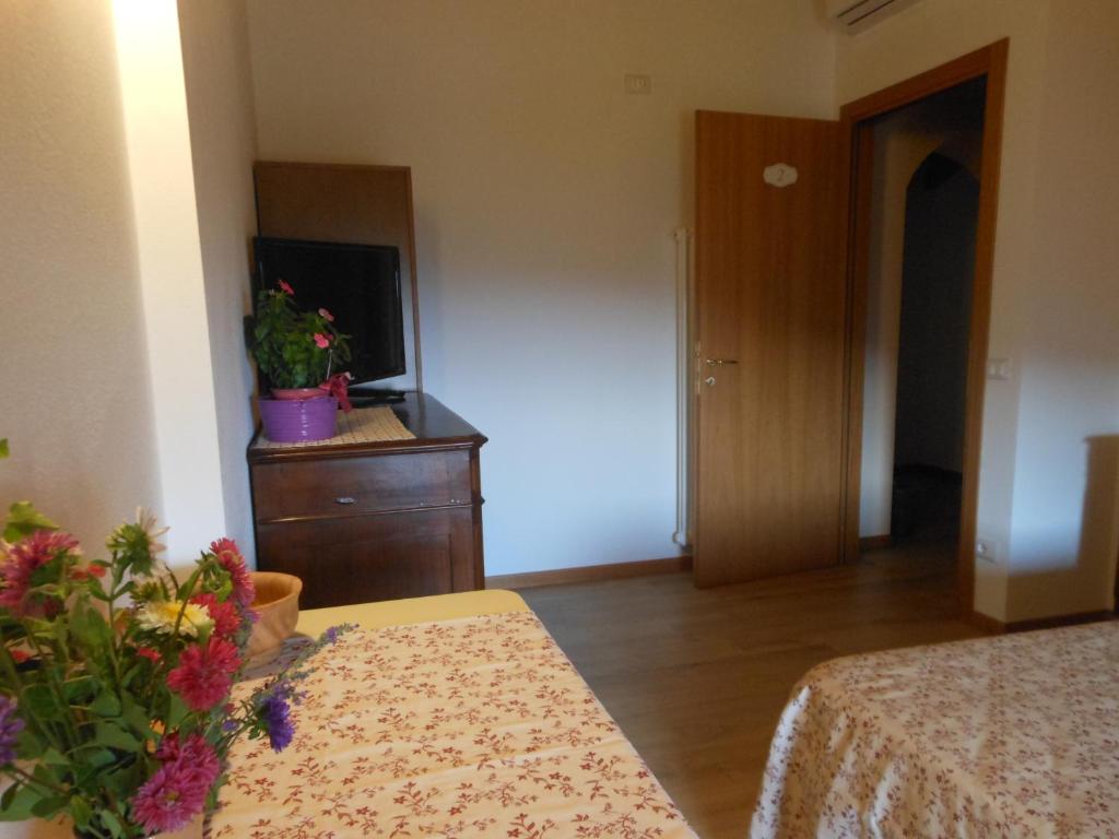 Posteľ alebo postele v izbe v ubytovaní B&B Paradiso
