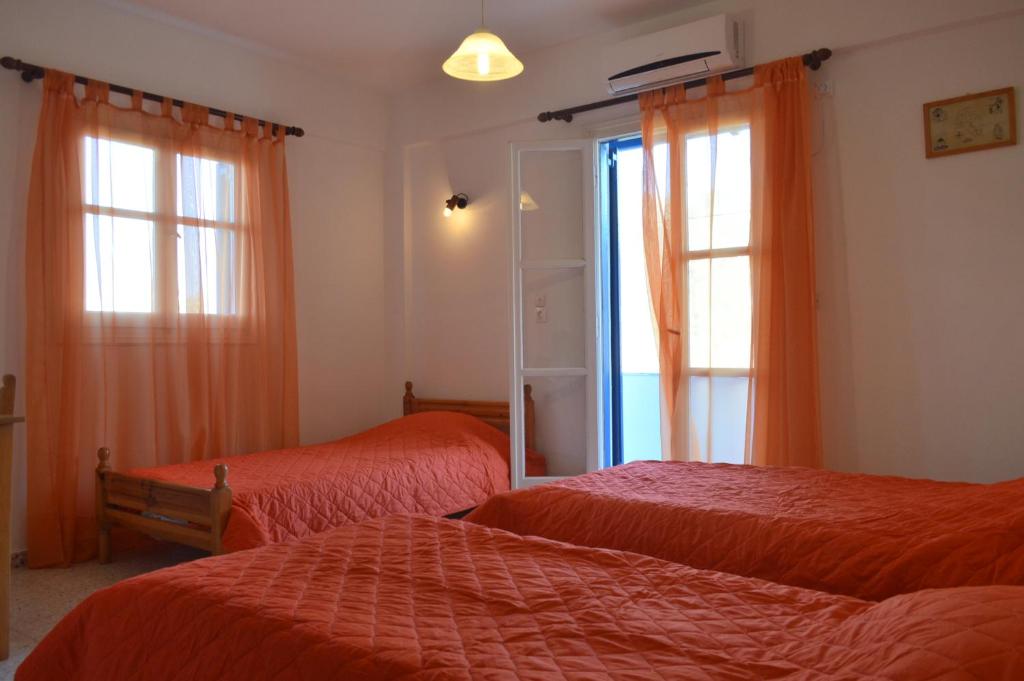 A bed or beds in a room at Koukos