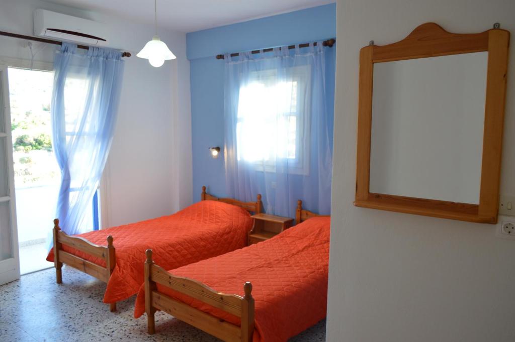 A bed or beds in a room at Koukos