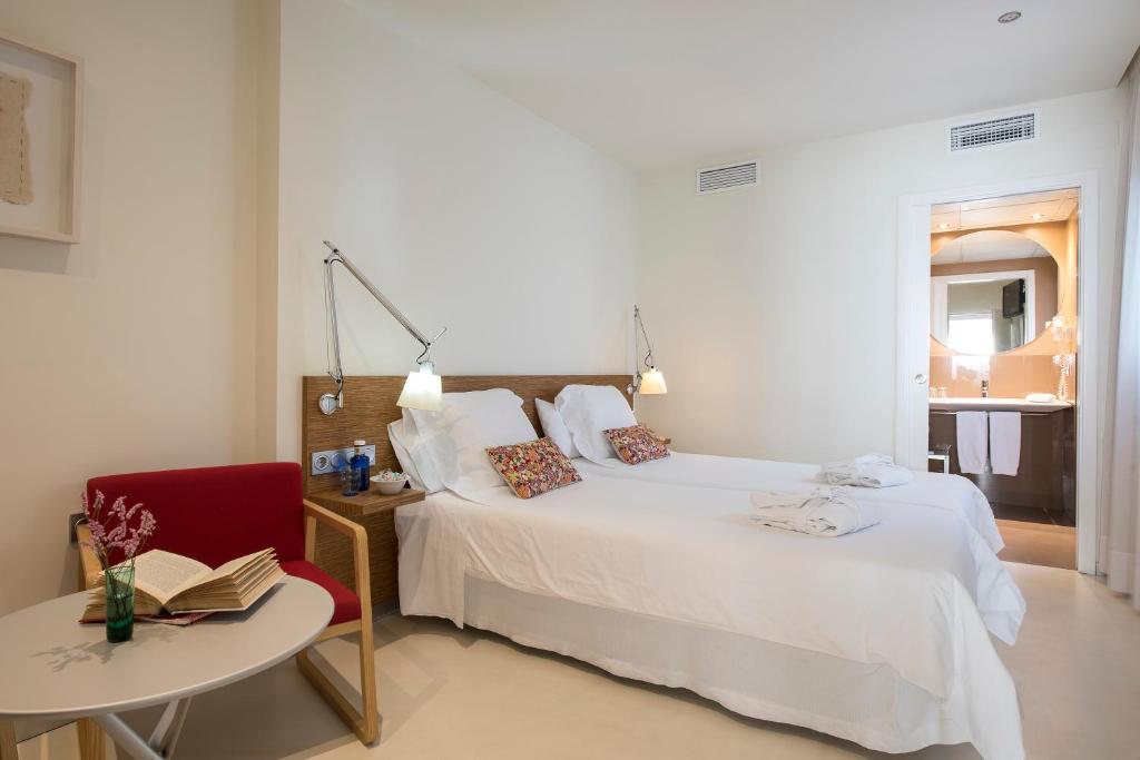 Postel nebo postele na pokoji v ubytování La Alcoba del Agua Hotel Boutique