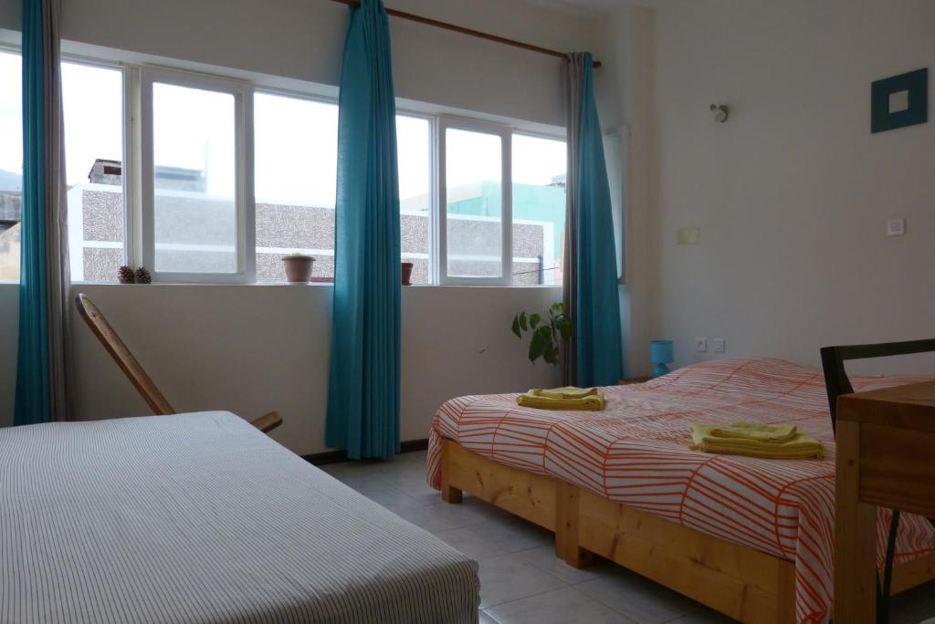 Postel nebo postele na pokoji v ubytování Casa D'Mar
