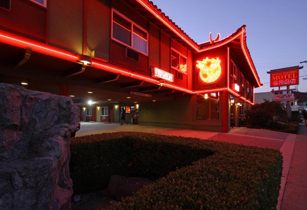 a hotel with a neon sign on the side of it at Royal Pagoda Motel Dodger Stadium in Los Angeles