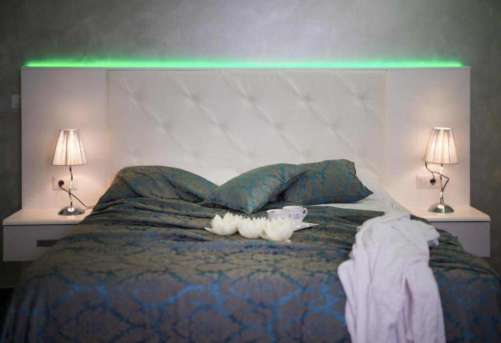 Łóżko lub łóżka w pokoju w obiekcie Hotel Boutique Natka