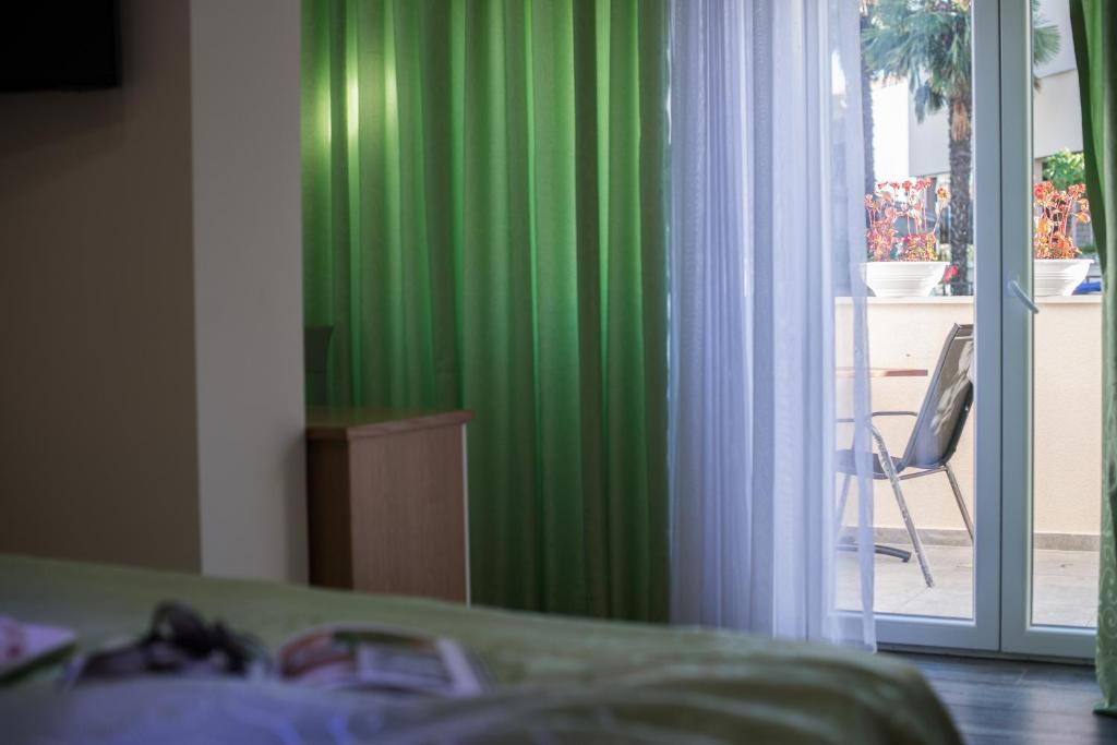 Łóżko lub łóżka w pokoju w obiekcie Hotel Boutique Natka