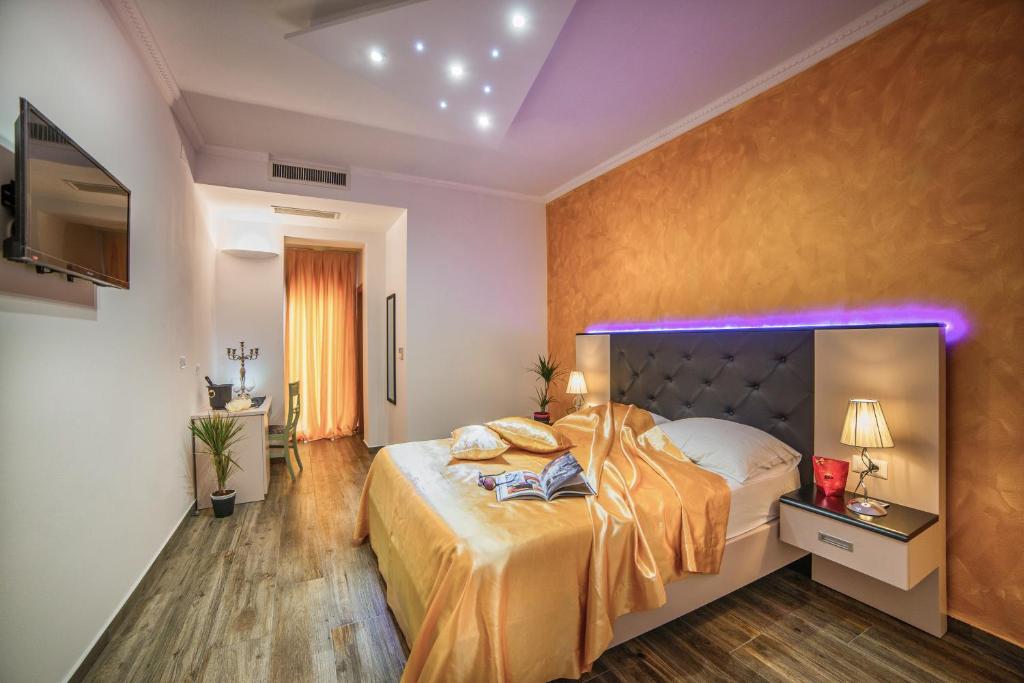 Łóżko lub łóżka w pokoju w obiekcie Hotel Boutique Natka