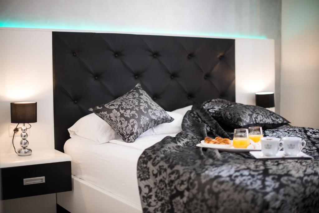 Łóżko lub łóżka w pokoju w obiekcie Hotel Boutique Natka