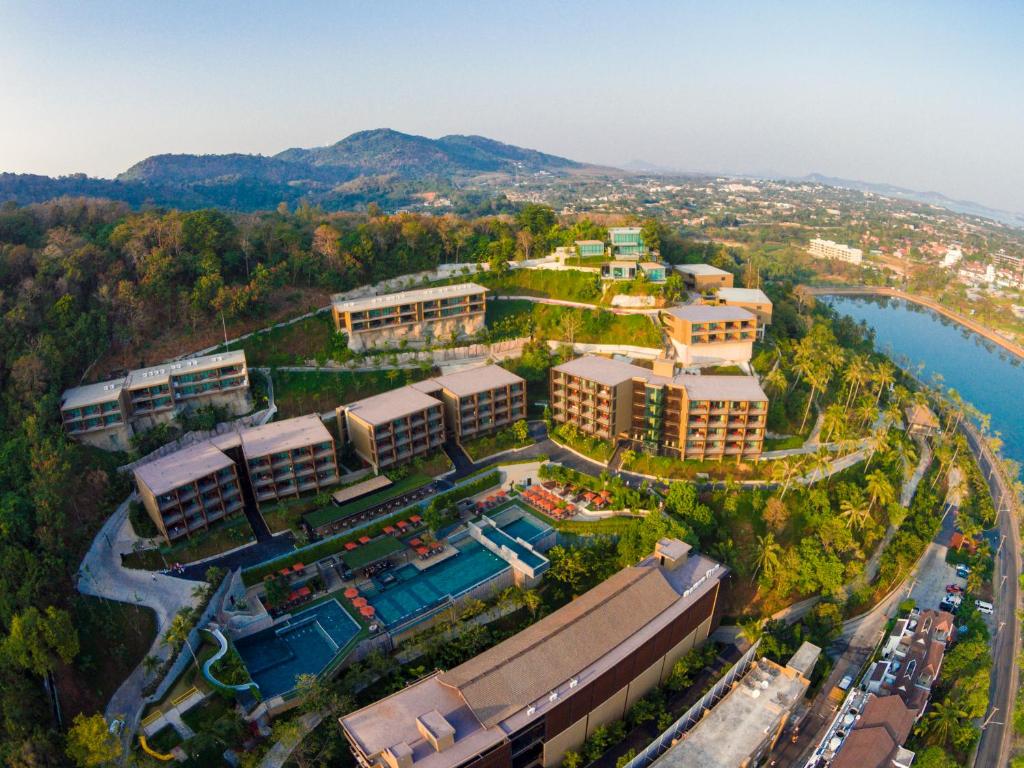 an aerial view of a resort with a swimming pool at Sunsuri Phuket - SHA Plus in Nai Harn Beach