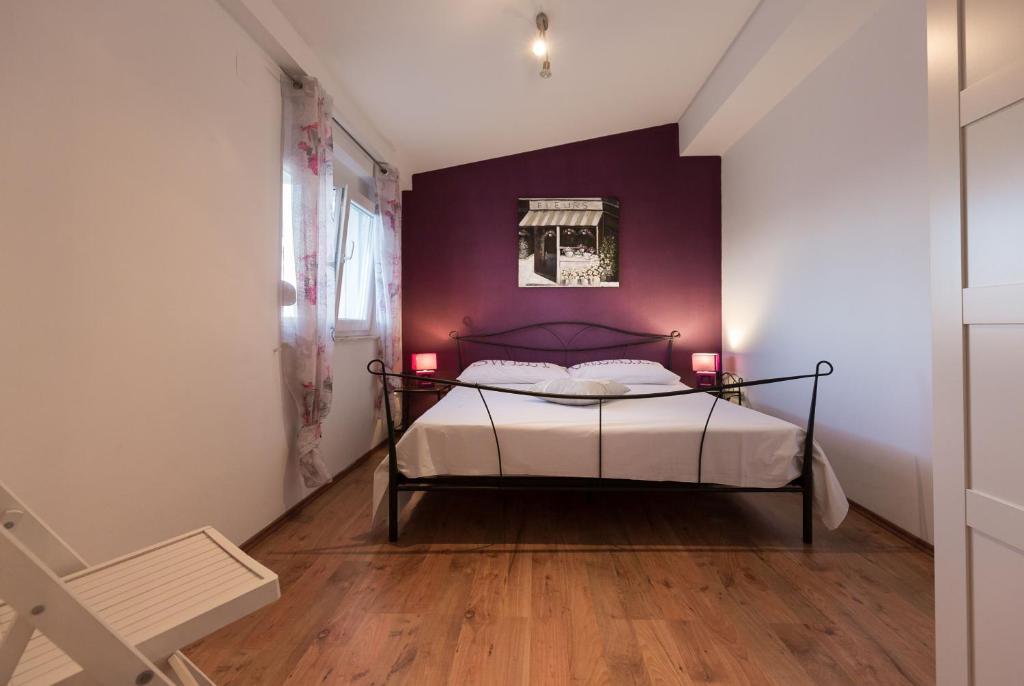 Posteľ alebo postele v izbe v ubytovaní Apartmani Maksan