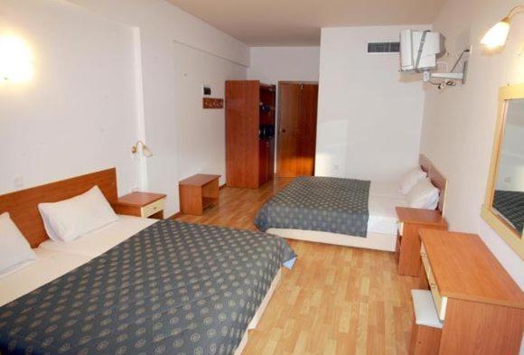 Postel nebo postele na pokoji v ubytování Hotel Filoxenia Beach