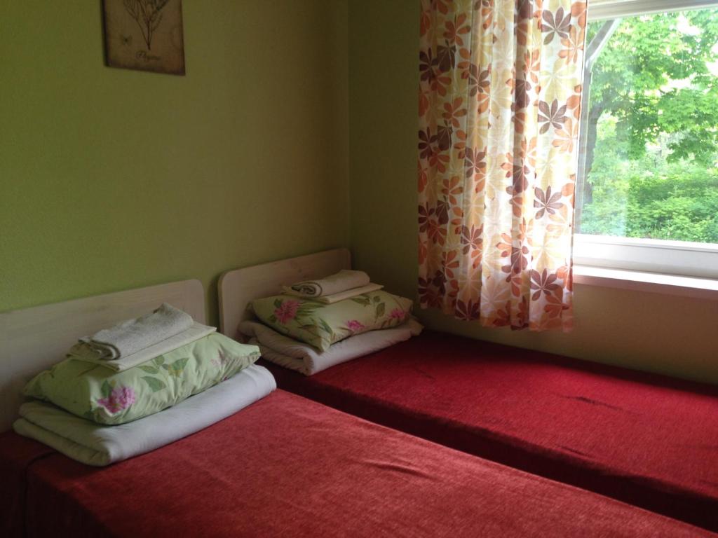 Postel nebo postele na pokoji v ubytování Sae Hostel