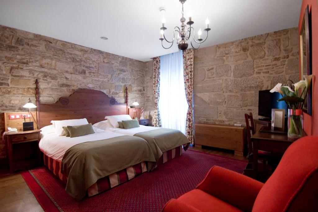 Postel nebo postele na pokoji v ubytování Hotel Virxe da Cerca by Pousadas de Compostela