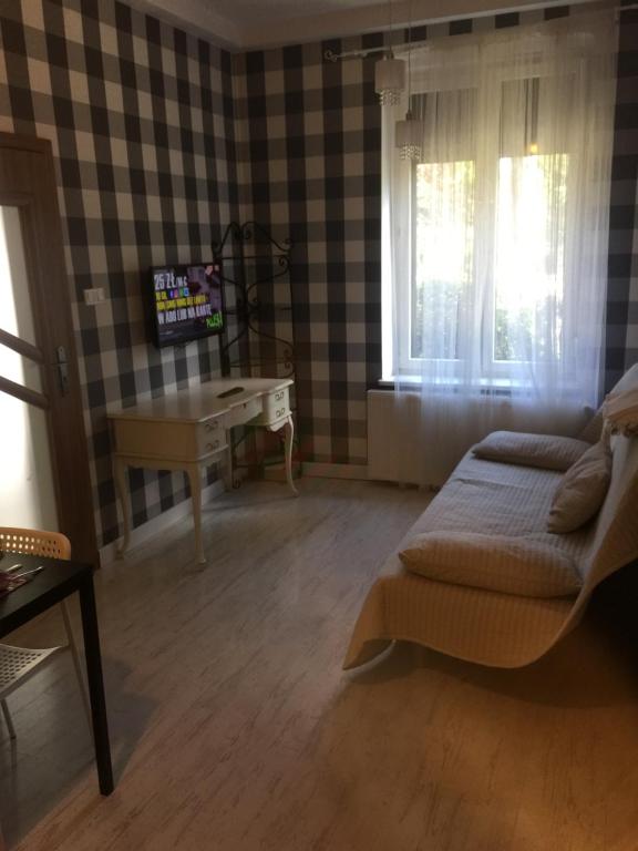 Telewizja i/lub zestaw kina domowego w obiekcie Vacation Apartments Sopot