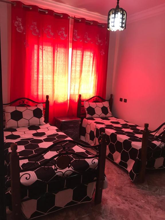 Postel nebo postele na pokoji v ubytování Appartements M'diq