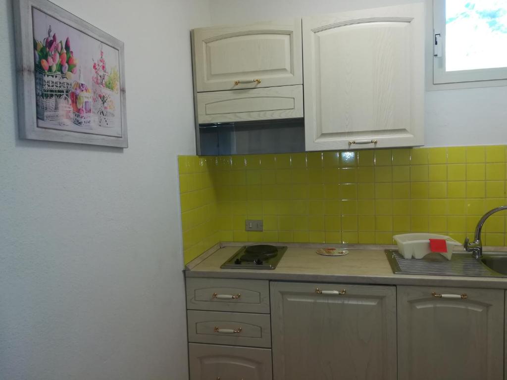 Kuchyň nebo kuchyňský kout v ubytování Hotel Nido D'aquila