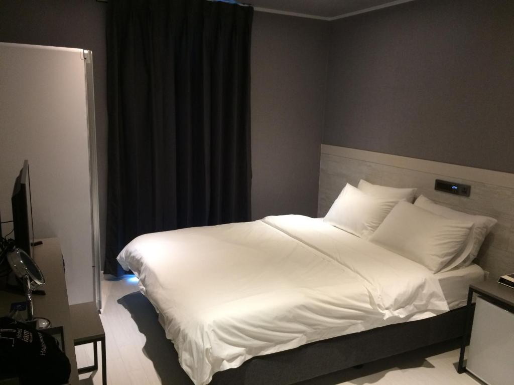 Postel nebo postele na pokoji v ubytování Hotel Iam