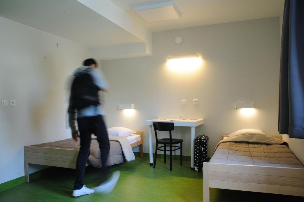 Postel nebo postele na pokoji v ubytování Hostel Bruegel