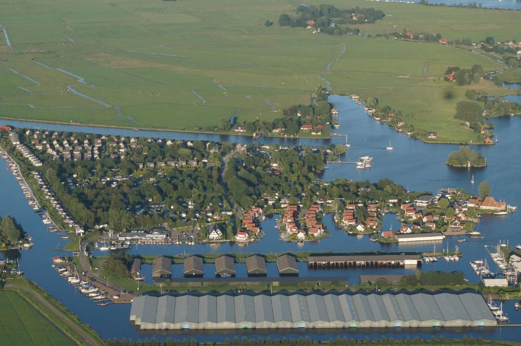 an aerial view of a harbor with a marina at Camping Yn'e Lijte in Grou