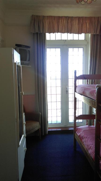 Postel nebo postele na pokoji v ubytování Havelock Guesthouse
