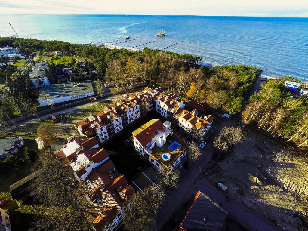 an aerial view of a house by the water at Apartament pod Dębami in Rowy