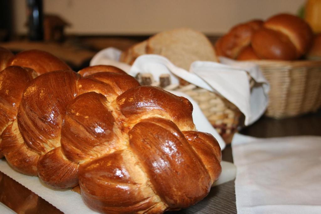 a bunch of loaves of bread on a table at Petersgrat in Kippel