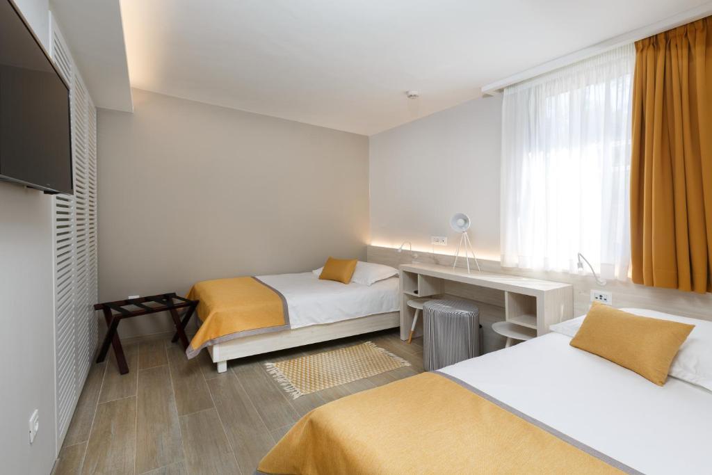 Ein Bett oder Betten in einem Zimmer der Unterkunft Villas Bellevue Plava Laguna