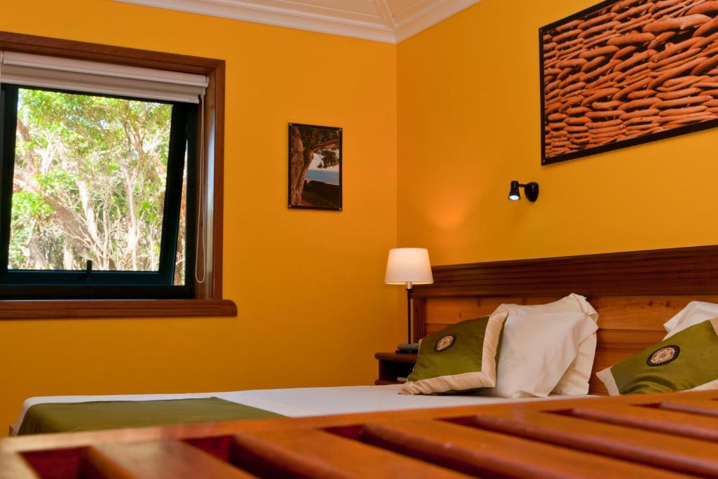 Postel nebo postele na pokoji v ubytování Aldeia da Fonte Hotel