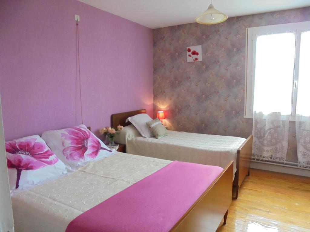 Postel nebo postele na pokoji v ubytování Chez Aline