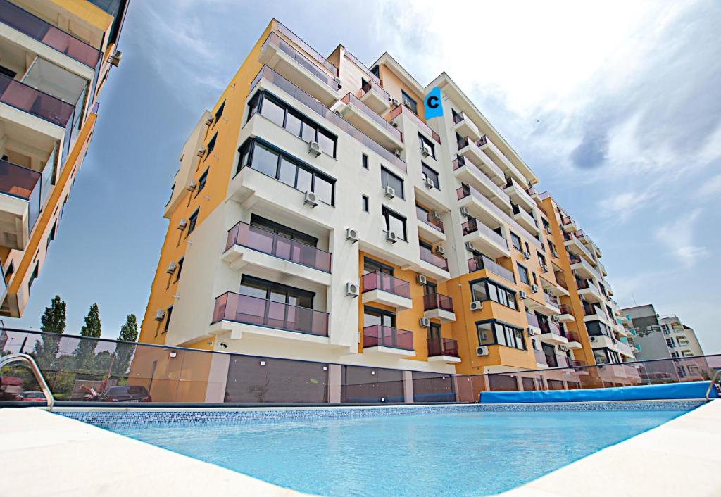 a building with a swimming pool in front of it at Vila Sophia 1 Mamaia in Mamaia