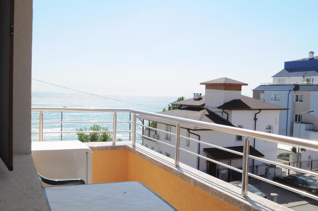 a balcony with a view of the ocean at Ivanka Guest House in Obzor
