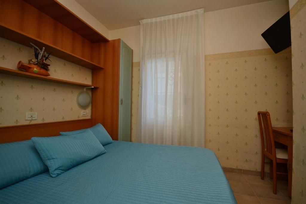 Postel nebo postele na pokoji v ubytování Hotel San Francisco Spiaggia