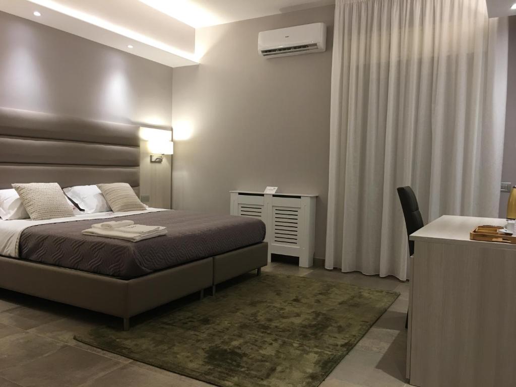 Postel nebo postele na pokoji v ubytování Alludo Aparthotel b&b