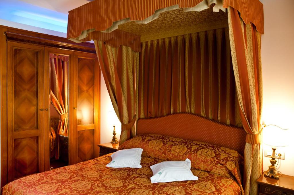 Postel nebo postele na pokoji v ubytování Hotel Beyfin