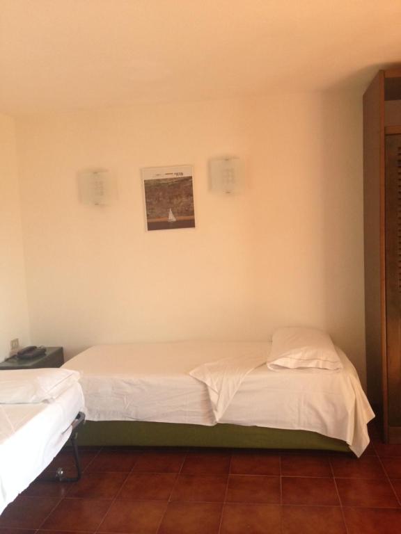 Posteľ alebo postele v izbe v ubytovaní Residenza Chrysalis Bay