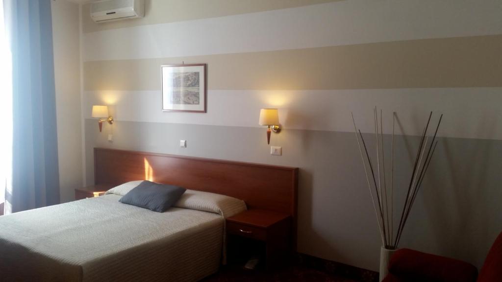 Cama o camas de una habitación en Hotel Alpi Resort