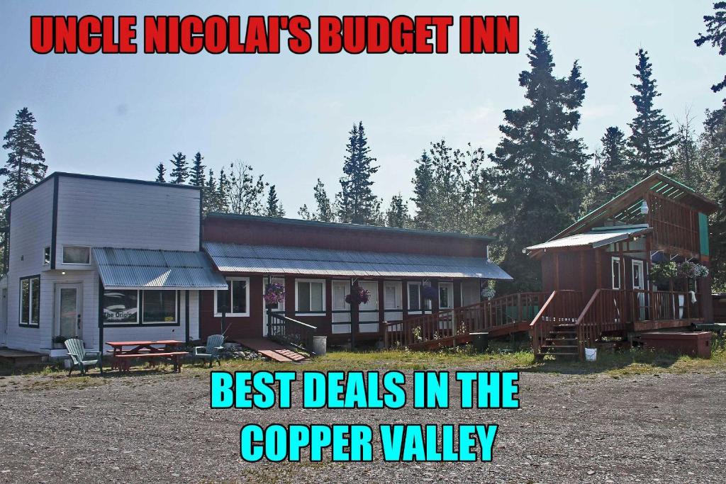 a house with the words uncle mexicans budget inn best deals in at Uncle Nicolai's Inn B&B in Copper Center