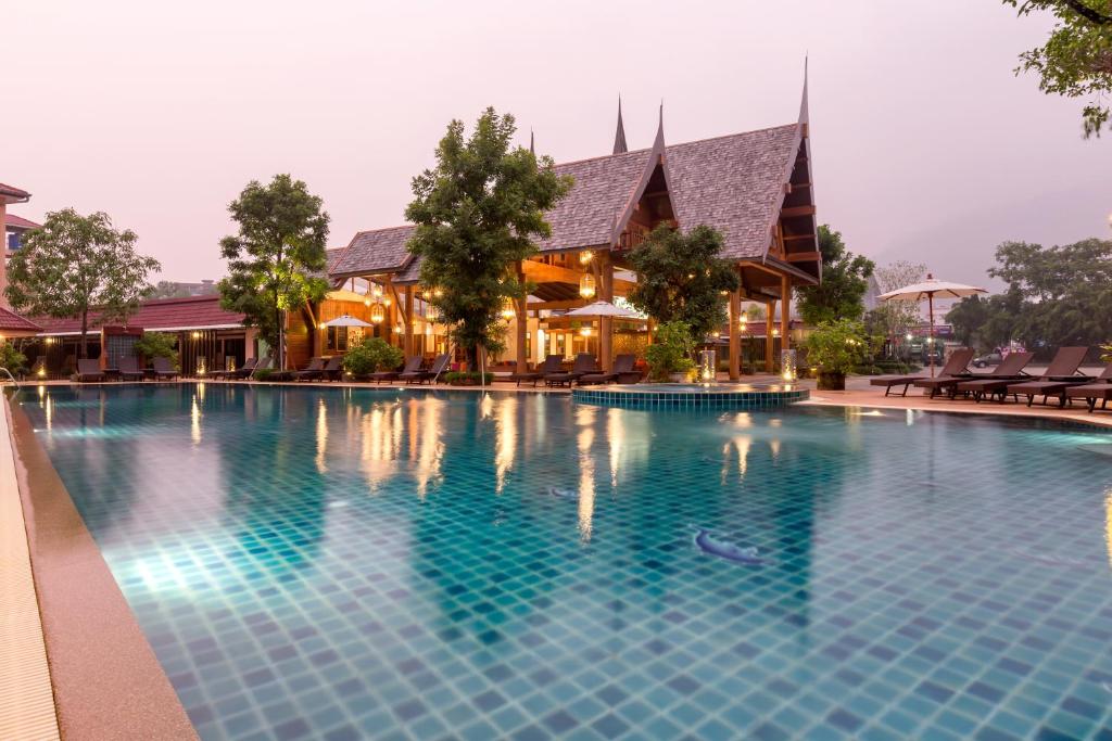 an image of a swimming pool at a resort at Naina Resort & Spa - SHA Extra Plus in Patong Beach