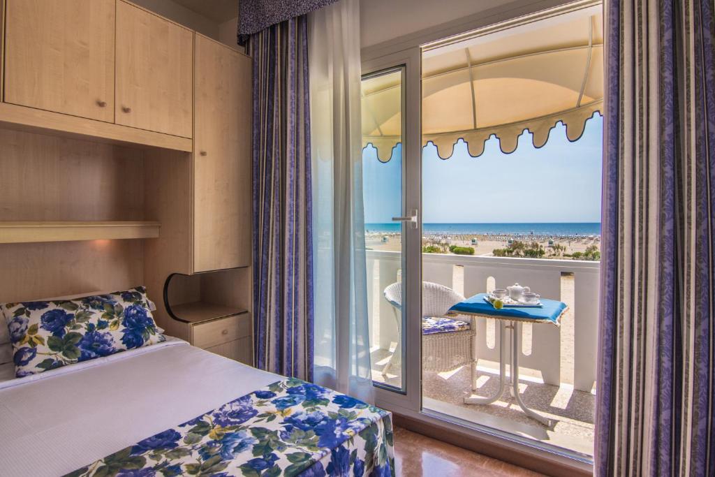 Postel nebo postele na pokoji v ubytování Hotel Doriana